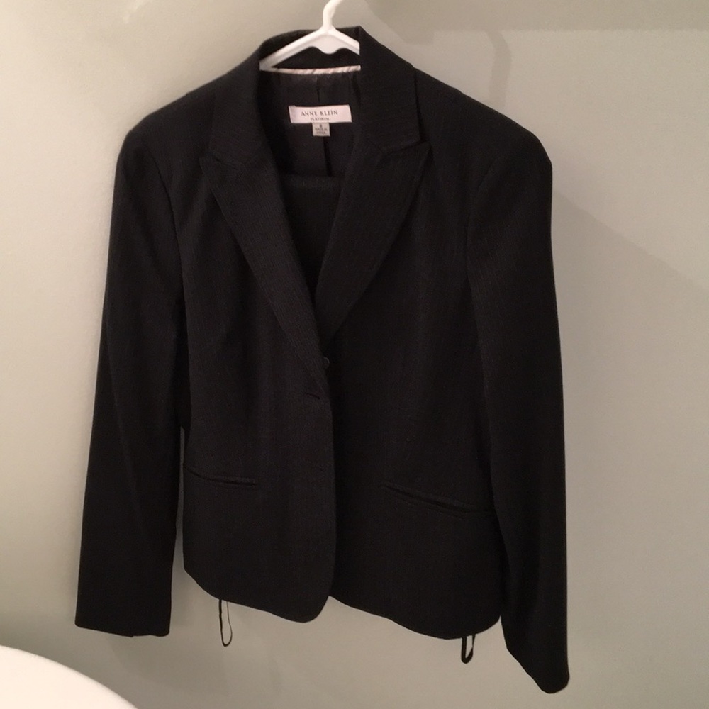 Women’s black pin stripe suit